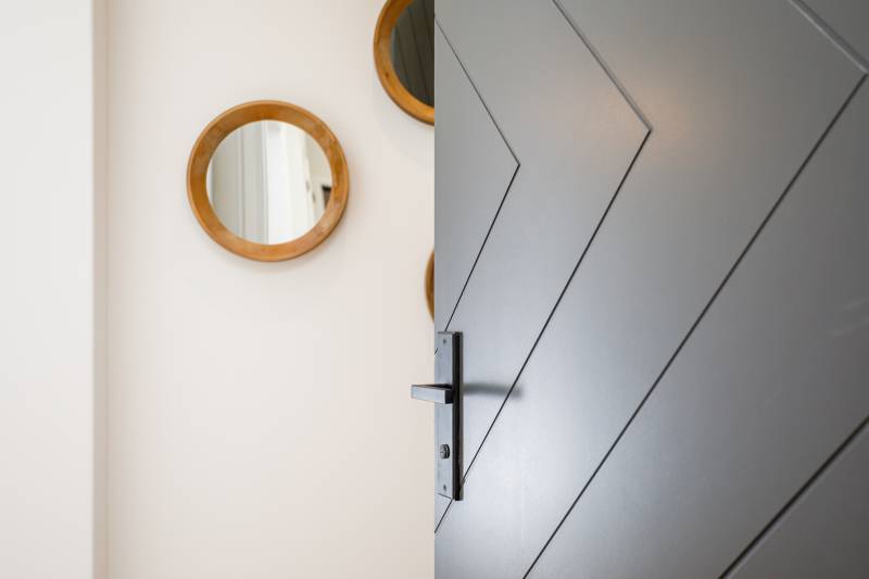 Close-up of modern grey interior wood door slab with groove